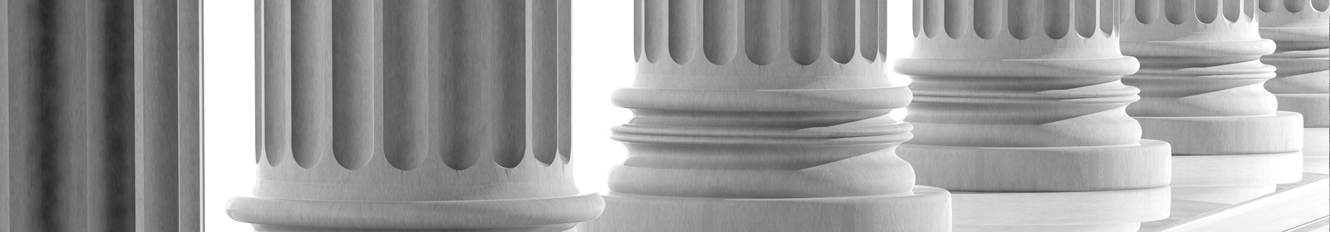 white marble pillars in front of a courthouse.